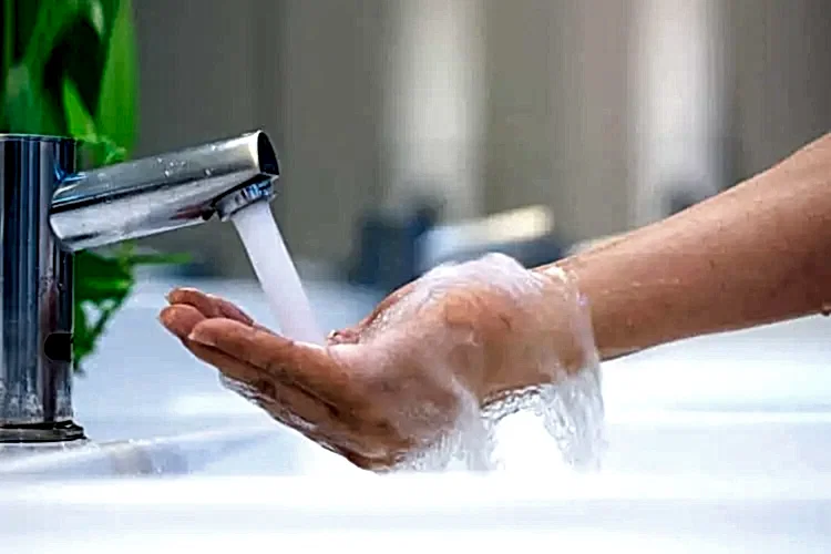 Faucet Streaming Water for Hot Water Heater Plumbing Services