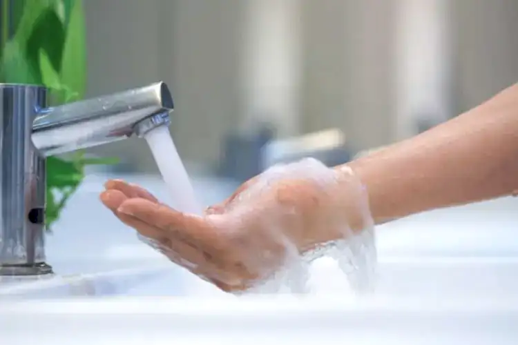 Faucet Streaming Water for Hot Water Heater Plumbing Services