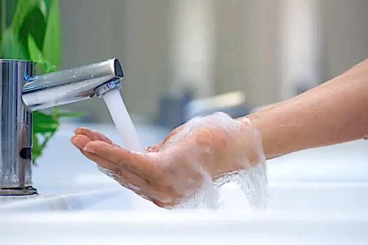 Faucet Streaming Water for Hot Water Heater Plumbing Services