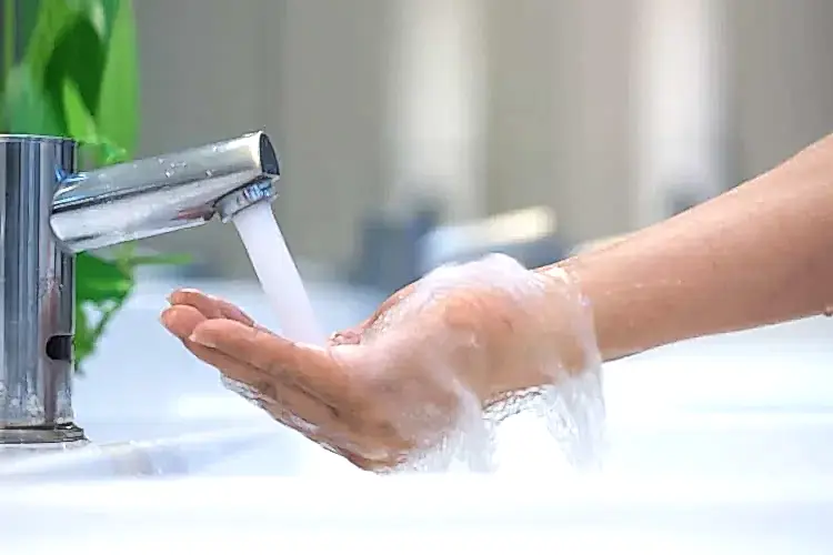 Faucet Streaming Water for Hot Water Heater Plumbing Services
