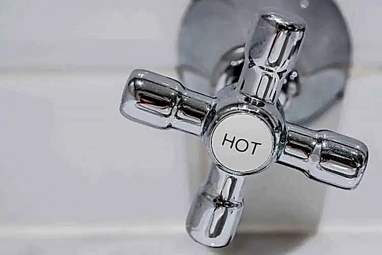 Hot Water Nozzle Stock Photo for Hot Water Heater Plumbing Services