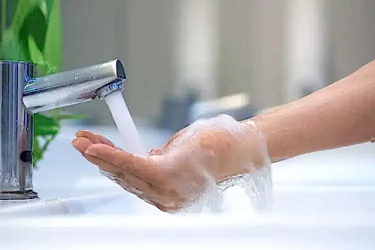 Faucet Streaming Water for Hot Water Heater Plumbing Services