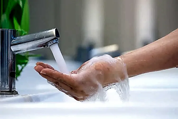 Faucet Streaming Water for Hot Water Heater Plumbing Services