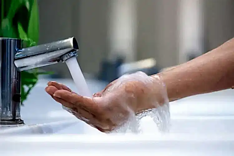 Faucet Streaming Water for Hot Water Heater Plumbing Services