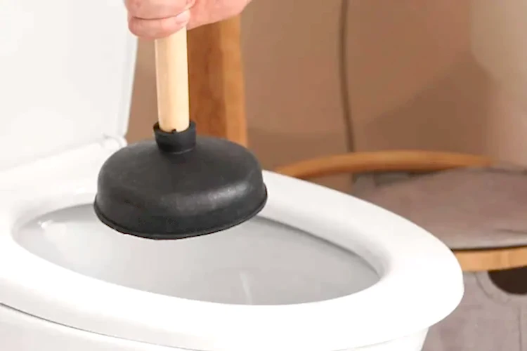 unclogging toilet