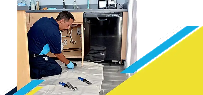 Z Plumberz technician laying out tools on floor