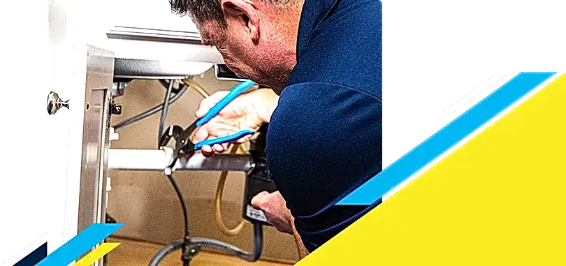 Z PLUMBERZ technician fixing pipe under a sink