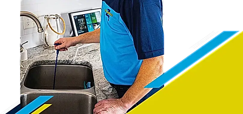 Z PLUMBERZ technician unclogging drain 