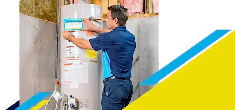 Z PLUMBERZ technician placing label on a water heater