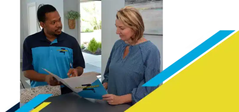 Z Plumberz technician talking to a customer