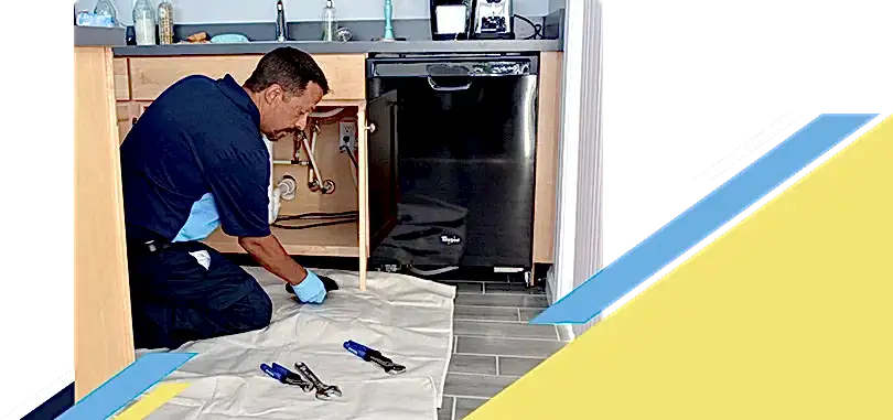 Z Plumberz technician laying out tools on floor