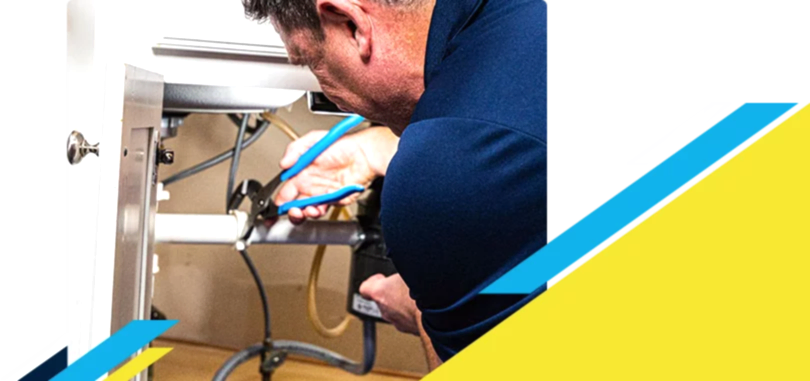 Z PLUMBERZ of Toledo technician fixing pipe under a sink