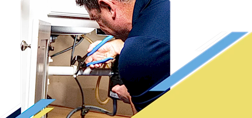 Z PLUMBERZ of Palm Beach technician fixing pipe under a sink