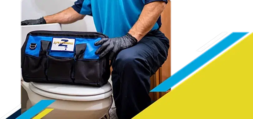Z PLUMBERZ of Palm Beach technician kneeling with tool bag on toilet