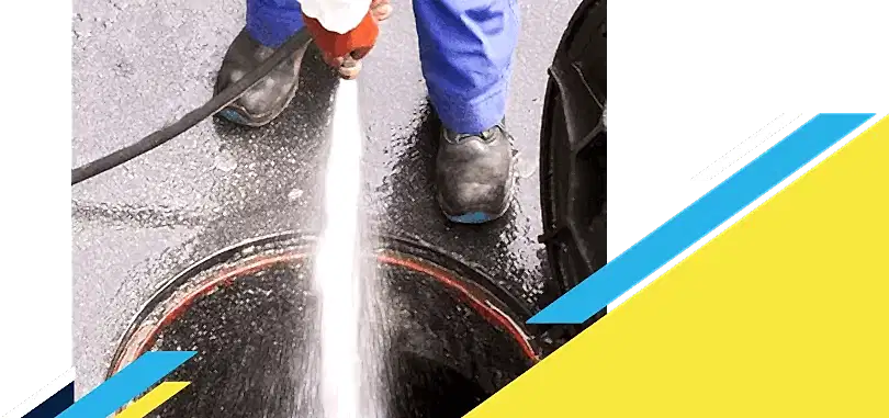 Z PLUMBERZ of Auburn Hills technician spraying water down a manhole