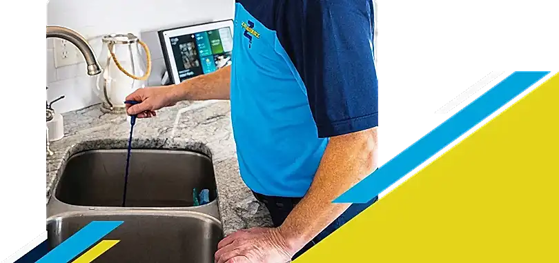 Z PLUMBERZ of Auburn Hills technician unclogging drain 