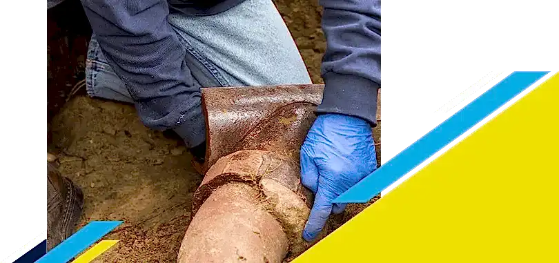 Z PLUMBERZ of North Dallas worker inspecting a sewer pipe