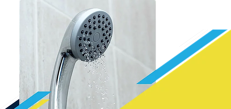 A shower head trickling water