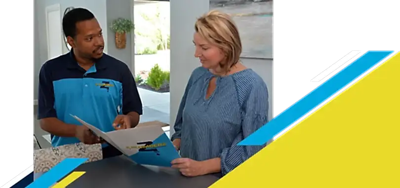 Z Plumberz technician talking to a customer