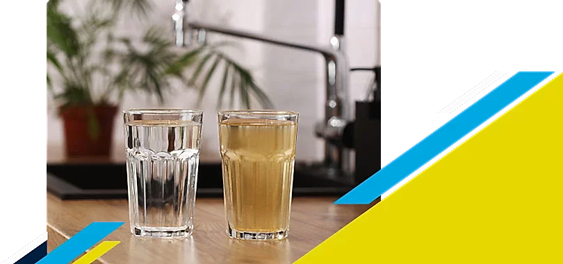 Two glasses full of water with one being clean and other dirty