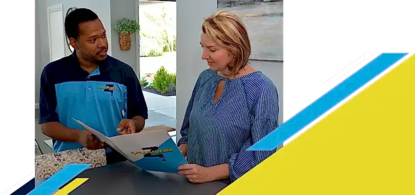 Z Plumberz technician talking to a customer