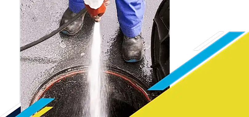 Z PLUMBERZ of Memphis technician spraying water down a manhole