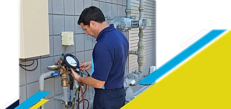 Z PLUMBERZ of Memphis technician using a tool to measure backflow