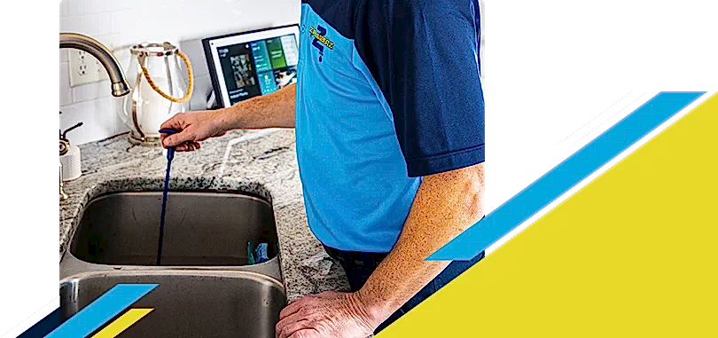 Z PLUMBERZ of Memphis technician unclogging drain 