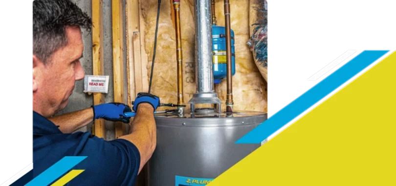Z PLUMBERZ of Ann Arbor technician fixing water heater