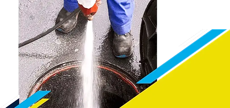 Z PLUMBERZ of Downriver technician spraying water down a manhole