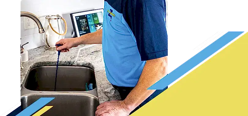 Z PLUMBERZ of Downriver technician unclogging drain 