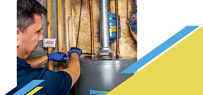 Z PLUMBERZ of Downriver technician fixing water heater