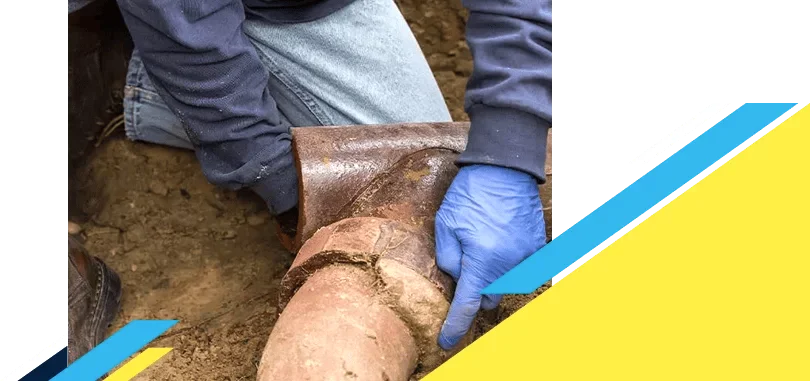Z PLUMBERZ of North America worker inspecting a sewer pipe