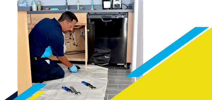 Z Plumberz technician laying out tools on floor