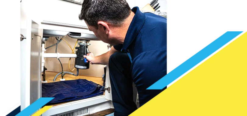 Z PLUMBERZ of Greater Boston technician fixing garbage disposal
