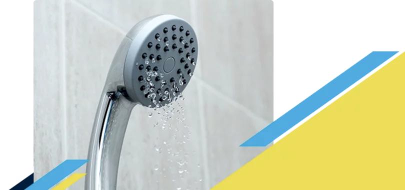 A shower head trickling water