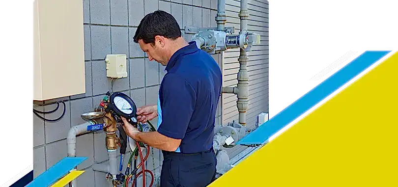 Z PLUMBERZ of Riverside technician using a tool to measure backflow
