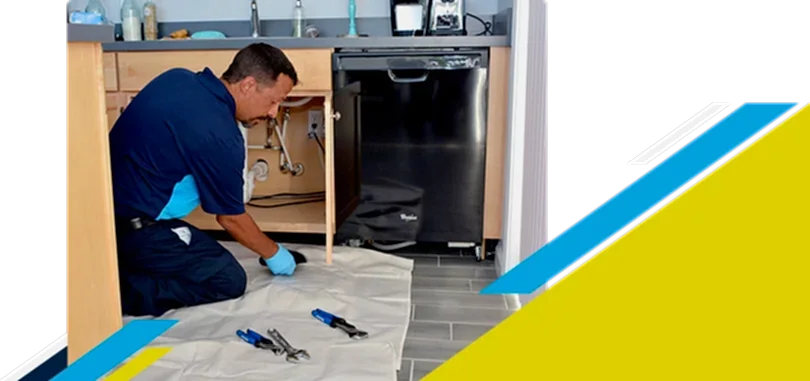 Z Plumberz technician laying out tools on floor
