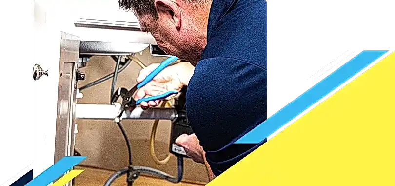 Z PLUMBERZ of Riverside technician fixing pipe under a sink