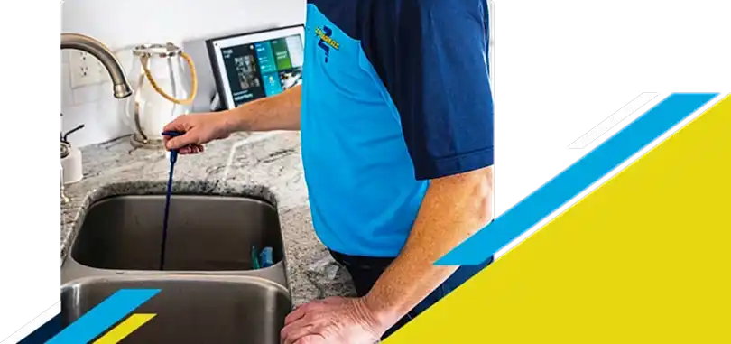Z PLUMBERZ of Riverside technician unclogging drain 