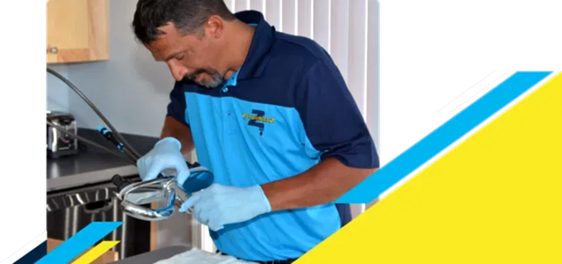 Z PLUMBERZ of Riverside technician inspecting sink faucet assembly