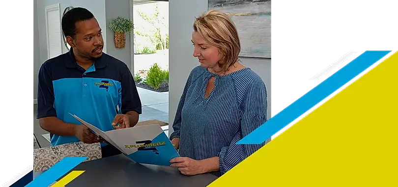 Z Plumberz technician talking to a customer