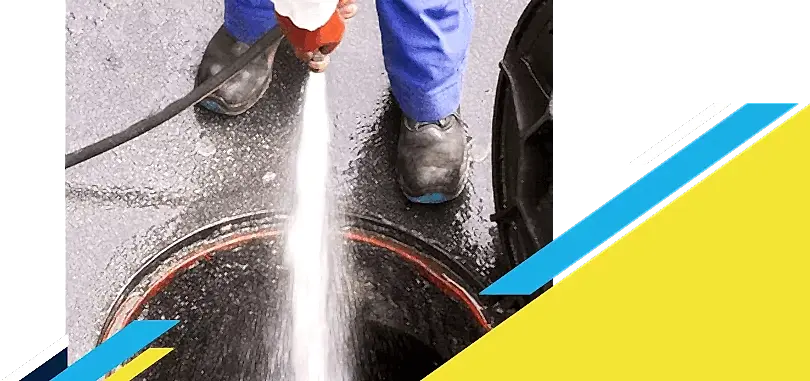 Z PLUMBERZ of Livingston technician spraying water down a manhole