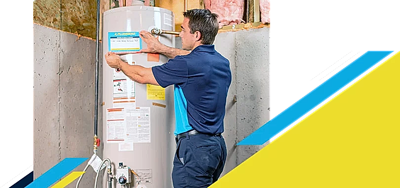 Z PLUMBERZ of Livingston technician placing label on a water heater
