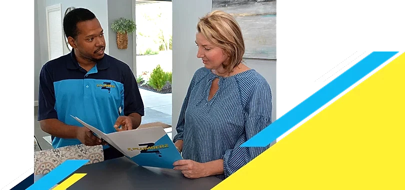 Z Plumberz technician talking to a customer