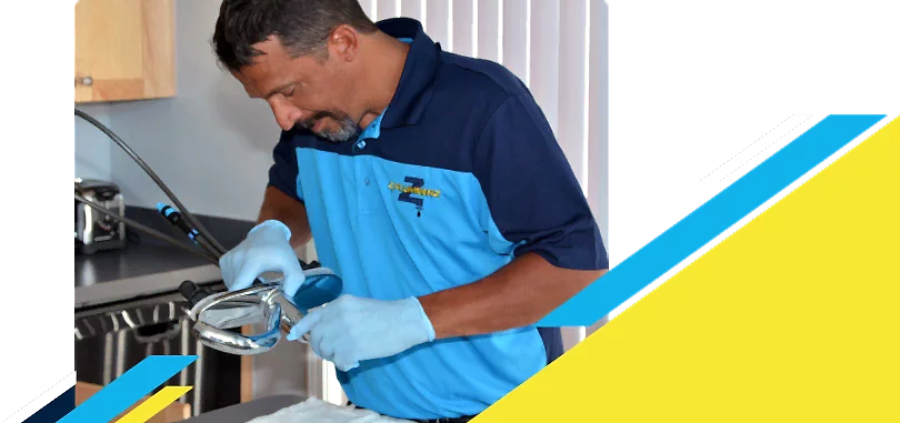 Z PLUMBERZ of Bergen technician inspecting sink faucet assembly