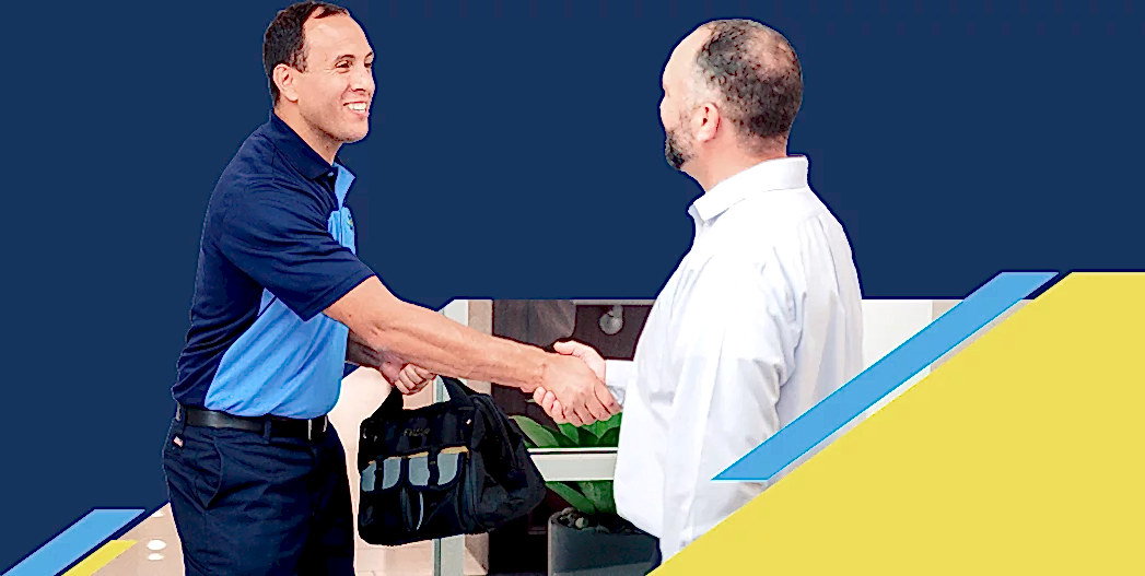 Z Plumberz technician shaking hands with a customer