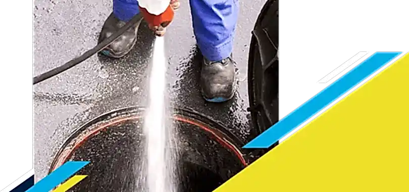 Z PLUMBERZ of Jupiter technician spraying water down a manhole