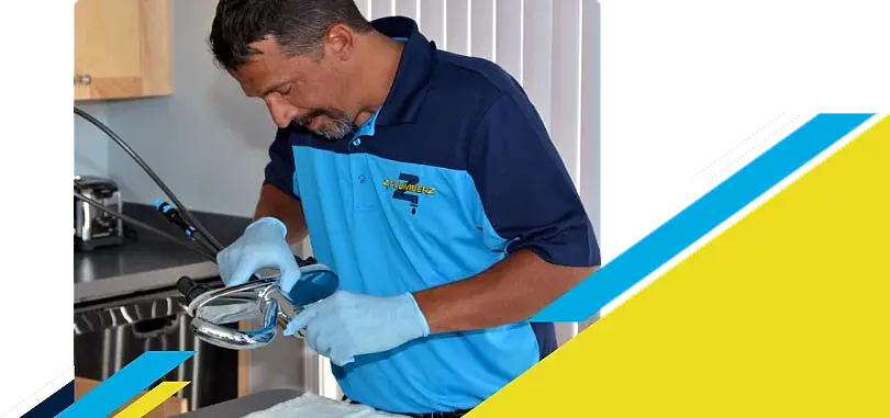 Z PLUMBERZ of Jupiter technician inspecting sink faucet assembly