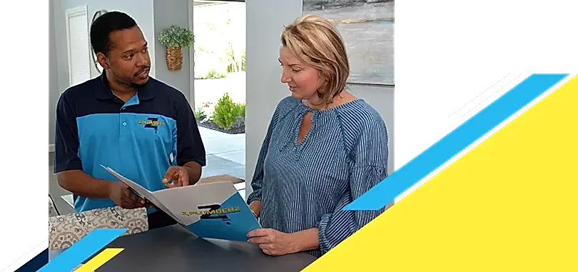 Z Plumberz technician talking to a customer